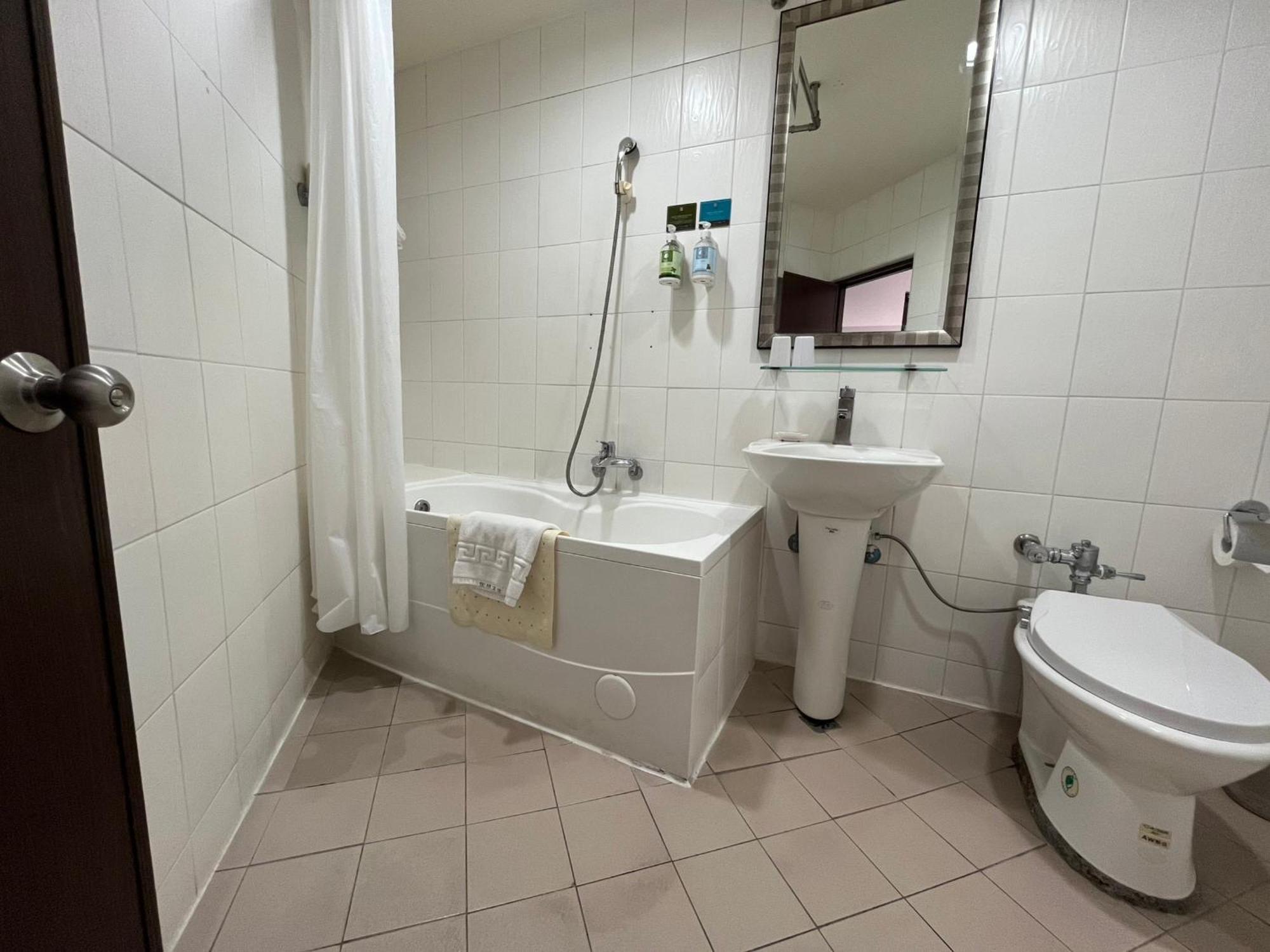 טאינאן Trust Hotel חדר תמונה